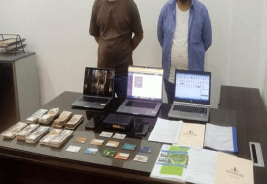 Confiscated laptops, smartphones, credit cards, and cash from the Streameast raid